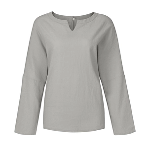 Macro shot of V-neckline detail and size label on grey cotton linen casual shirt