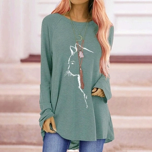Close-up of the elegant cat line art print on a loose-fit long-sleeve raglan tee shirt