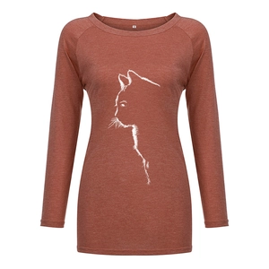 Detail view of M size label and minimalist cat print on rust red raglan sleeve tee