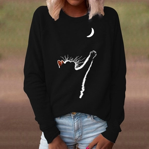 Detail of crewneck sweatshirt showing cat and moon graphic with ribbed cuffs and hem