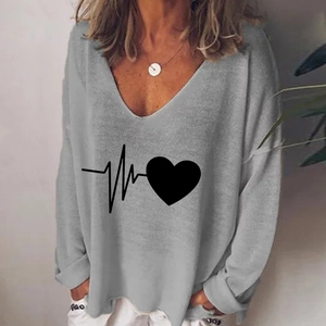 Detail of the V-neckline and creative black heart print on a grey long-sleeve T-shirt