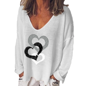 Close-up of V-neckline and heart print on white long-sleeved women's casual T-shirt