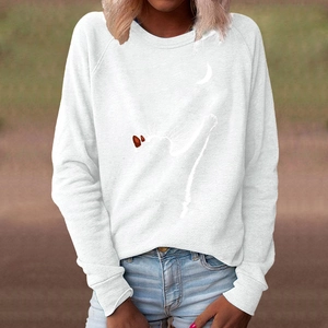 Close-up of white crew neck sweatshirt featuring a minimalist cat and moon graphic