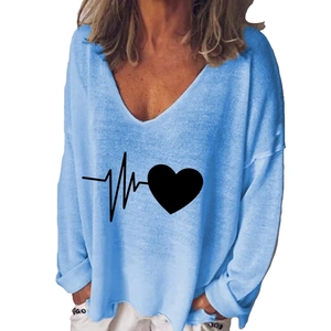 Detail of creative heart print on light blue V-neck long sleeve casual women shirt