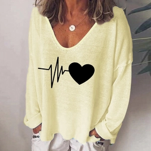Pale yellow V-neck long sleeve T-shirt with heart graphic and loose shoulder fit