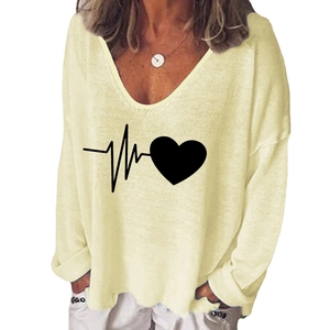 Detail of the heart pulse print on a cream V-neck long sleeve T-shirt for women