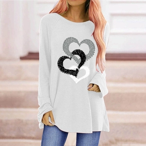 Detailed close-up of three overlapping heart prints on white long sleeve cotton t-shirt