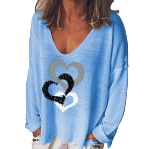 Light blue V-neck long sleeve t-shirt featuring creative interlocking heart print patterns