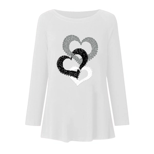 Close-up of three layered heart prints and neckline on a white long sleeve T-shirt