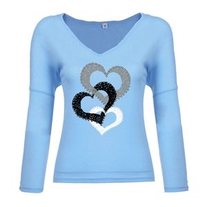Detail of V-neckline and heart print on sky blue long-sleeved cotton blend shirt