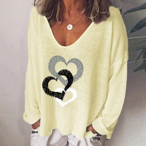 Light yellow V-neck long sleeve shirt featuring creative interlocking heart print design