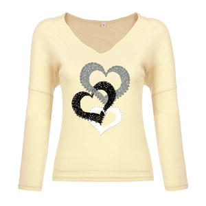 Detail of V-neck collar with size M label and artistic layered heart print on apricot top