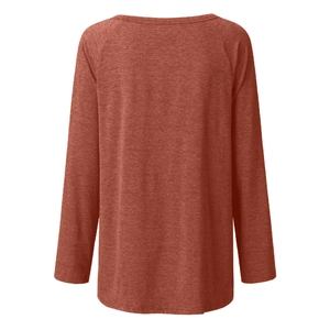 Detail view of brick red raglan sleeve crewneck t-shirt with knit fabric texture