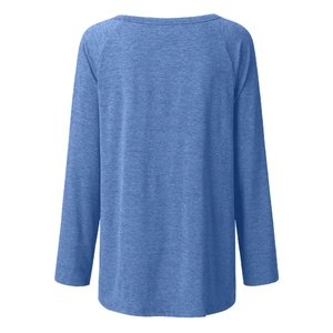 Back view of a loose blue marled raglan sleeve T-shirt with textured knit fabric details