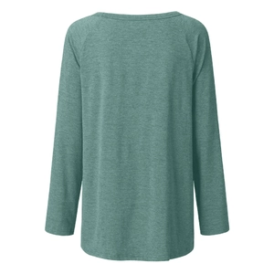 Close-up of sage green raglan sleeve t-shirt with detailed marled knit texture