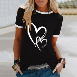 Detail of a casual black ringer T-shirt with white heart prints and contrast trim