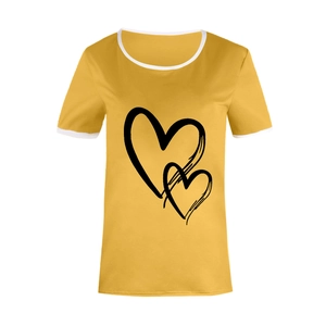 Close-up of contrast white trim on crew neck and black heart print on ginger t-shirt