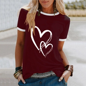 Detail of burgundy T-shirt with white heart print and contrasting neckline trim
