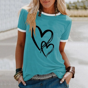 Detail of teal t-shirt featuring overlapping black hearts and white contrast collar trims