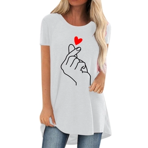 Detailed close-up of a finger heart print on a white casual cotton T-shirt