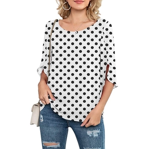Detailed close-up of white polka dot chiffon blouse featuring stylish slit bell sleeves