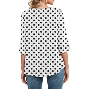 Back view of elegant women's loose top with classic black polka dots and 3/4 sleeves