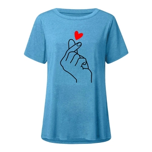 Close-up of heart hand gesture print and red heart detail on blue short sleeve T-shirt