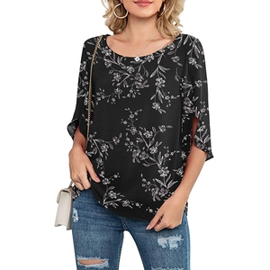 Detail of split cuffs and white floral print on a black round neck casual women blouse