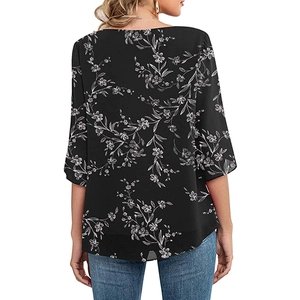 Detailed back view of a loose fit women's black floral top with elegant 3/4 sleeves