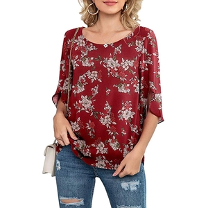 Close-up of elegant floral print top with split 3/4 sleeves and round neckline