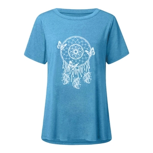 Close-up detail of white dreamcatcher and butterfly print on light blue casual T-shirt