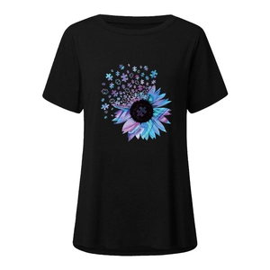 Close-up of women's black round neck T-shirt featuring a colorful sunflower puzzle print