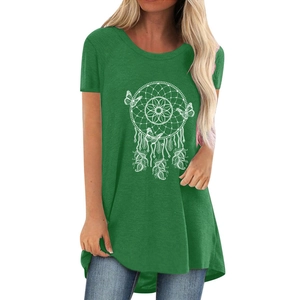 Detail of dreamcatcher and butterfly print on green cotton t-shirt with curved hemline