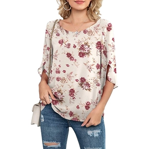 Detail of elegant floral print top with 3/4 sleeves and unique split cuff design
