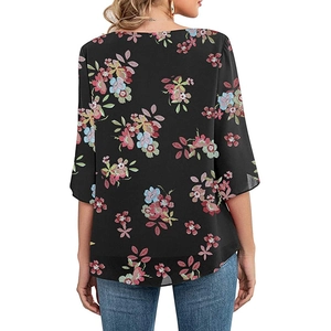 Back view of elegant black floral print blouse with 3/4 sleeves and lightweight fabric
