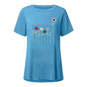 Detail of light blue crew neck T-shirt featuring colorful geometric floral print patterns