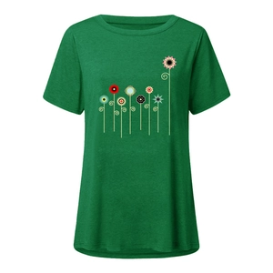 Close-up of vibrant abstract floral print on a forest green short sleeve T-shirt