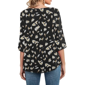 Detail of elegant black floral blouse with 3/4 sleeves and white tulip pattern back view