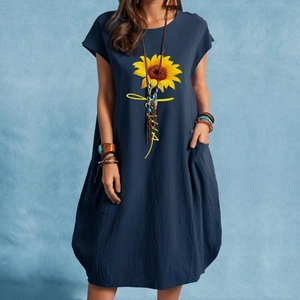 Detailed close-up of dark blue linen sunflower dress with loose fit and side pockets