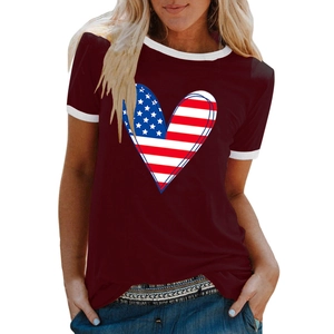 Close-up of heart-shaped American flag print on a burgundy short-sleeved T-shirt