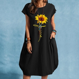 Detailed view of sunflower faith print on black loose cotton linen pocket dress