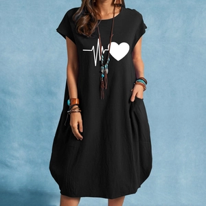 Detail view of cotton linen dress featuring heart heartbeat print and side pockets