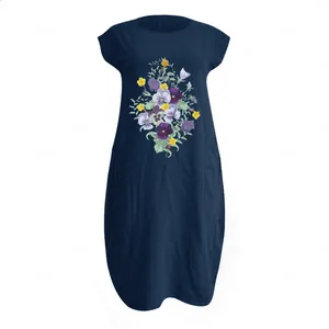 Close-up of floral print and natural cotton linen texture on navy midi dress