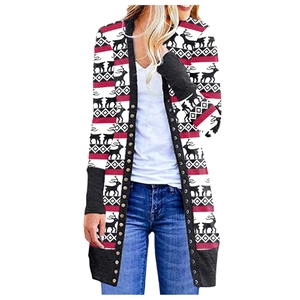 Detail of Christmas cardigan featuring reindeer motifs and fair isle geometric patterns