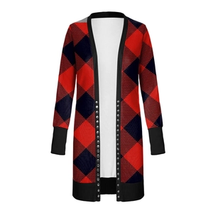 Detail of red and black buffalo plaid cardigan featuring silver metal snap buttons