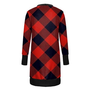 Detail of red and black buffalo plaid pattern with black ribbed knit cuffs and hem