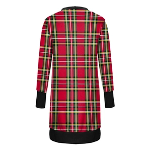 Detail of tartan pattern long sleeve cardigan with black ribbed cuffs and white background