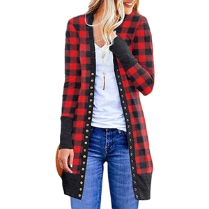 Detail of red and black buffalo plaid cardigan featuring metallic button trim and ribbed cuffs