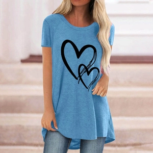 Close-up of overlapping black heart prints on a light blue round neck cotton T-shirt