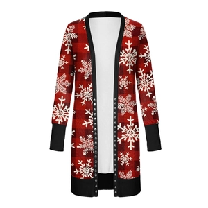 Detail of red buffalo plaid Christmas cardigan with white snowflake patterns and buttons